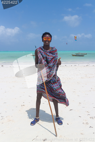 Image of Traditonaly dressed black man on Paje beach, Zanzibar, Tanzania, East Africa.