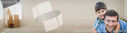 Image of Young Caucasian Father and Son Inside Room with Boxes Banner.