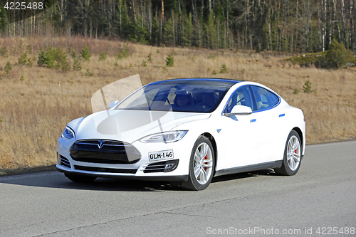 Image of White Tesla Model S Electric Car on the Road