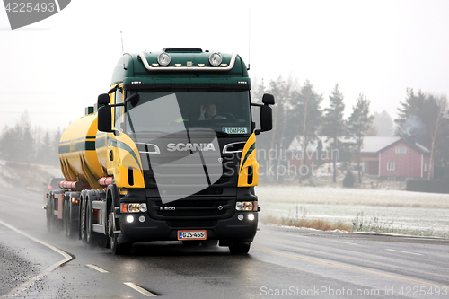 Image of Colorful Scania R500 Pushes Through Fog