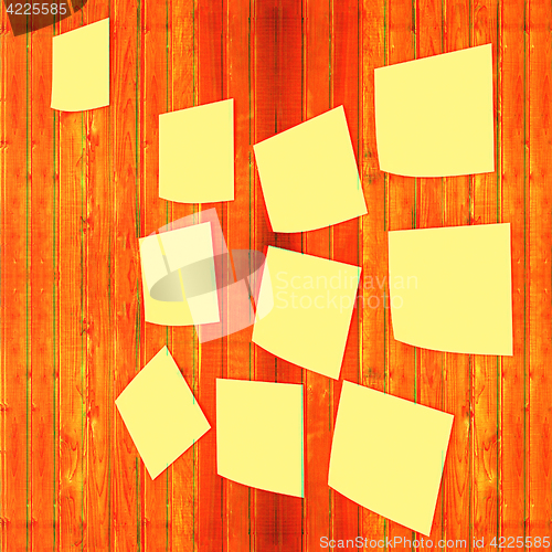 Image of Mock-up of Sticky note paper on a wooden wall. 3D illustration. 