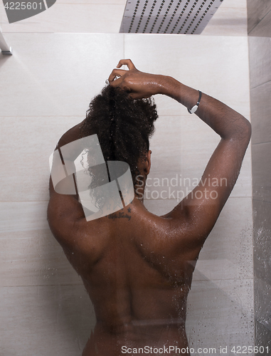 Image of African American woman in the shower