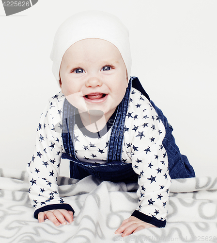 Image of little cute baby toddler on carpet isolated close up smiling ado