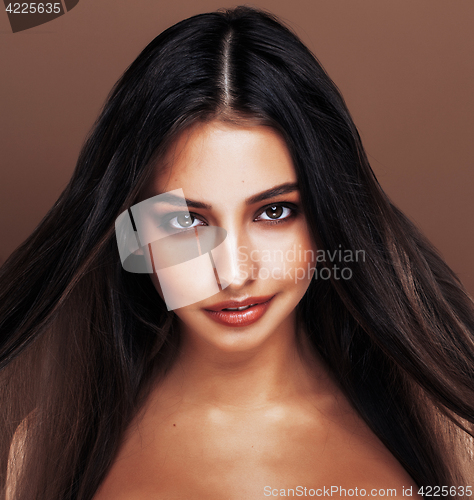 Image of cute happy young indian woman in studio close up smiling, fashion mulatto