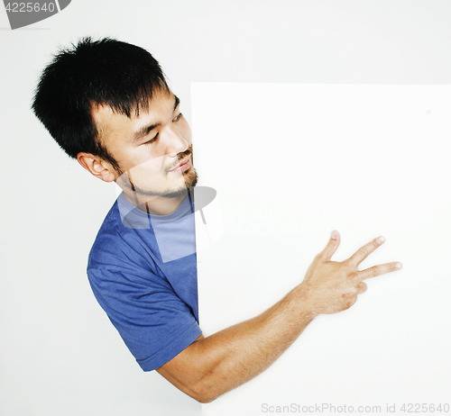 Image of pretty cool asian man holding empty white plate smiling