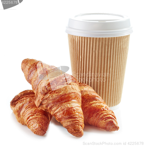 Image of Cup of coffee and croissants