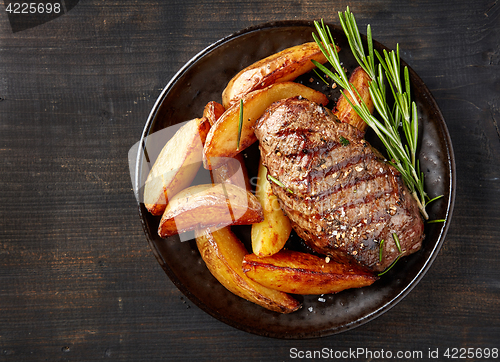 Image of grilled beef steak and potatoes