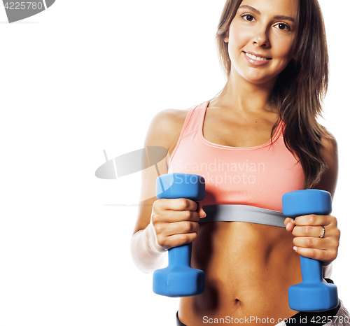 Image of young pretty slim woman with dumbbell isolated