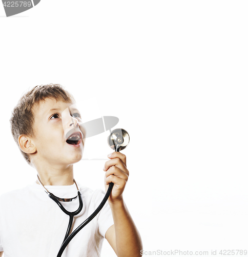 Image of little cute boy with stethoscope playing like adult profession d