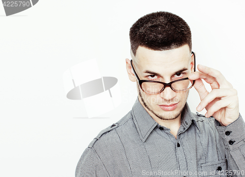 Image of young handsome well-groomed guy posing emotional on white background, lifestyle people concept 