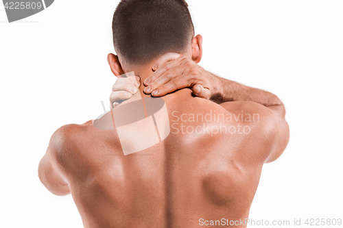 Image of Studio shot of man with pain in neck