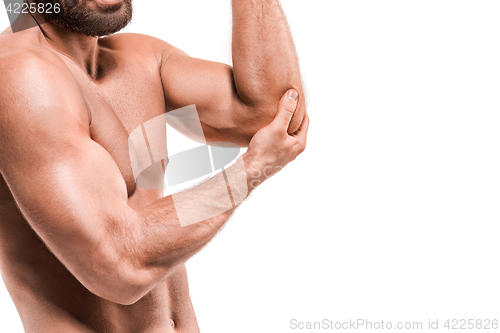 Image of Man With Pain In Elbow. Pain relief concept