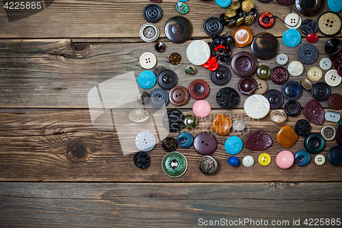 Image of vintage buttons on the wooden boards