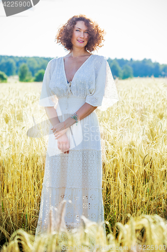 Image of charming woman dressed in white