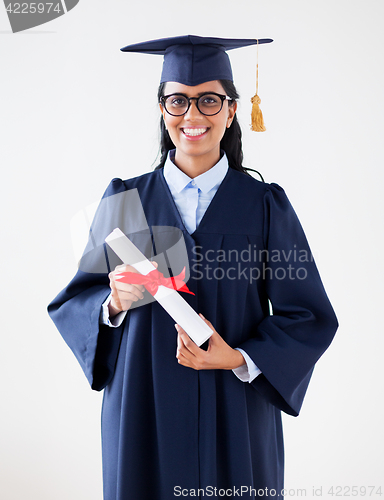 Image of happy bachelor woman in mortarboard with diplomas