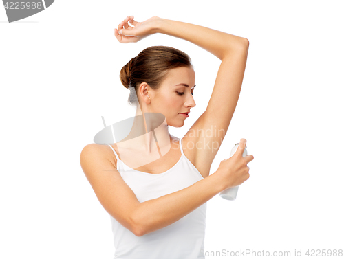 Image of woman with antiperspirant deodorant over white