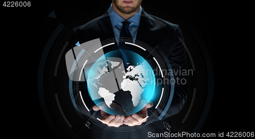 Image of close up of businessman with earth projection