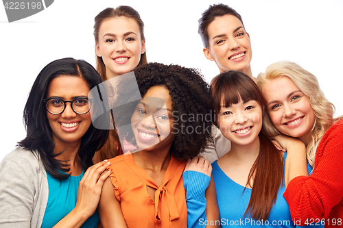 Image of international group of happy women hugging