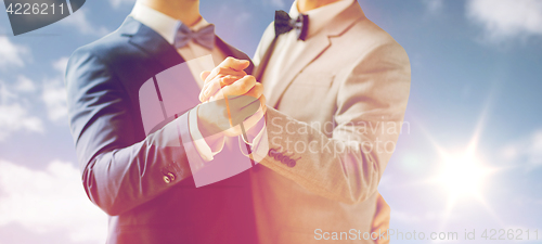 Image of close up of happy male gay couple dancing