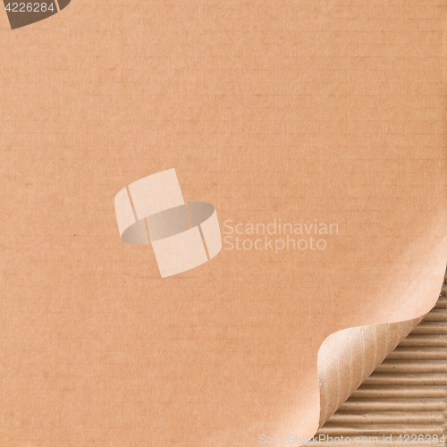 Image of Corrugated cardboard with curled corner