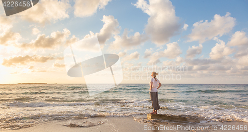 Image of Free Happy Woman Enjoying Sunset on Sandy Beach