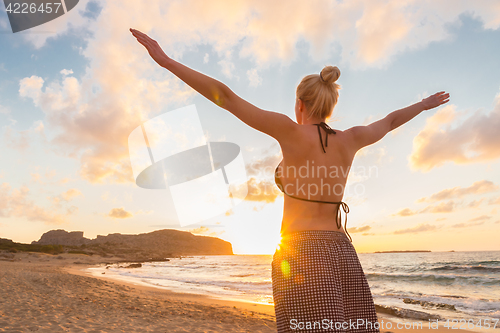 Image of Free Happy Woman Enjoying Sunset on Sandy Beach