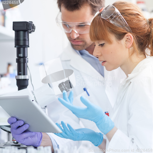 Image of Health care researchers working in scientific laboratory.