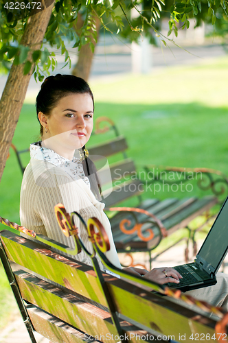 Image of Business woman in summer park