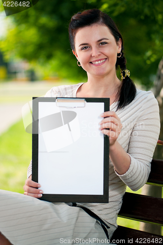 Image of Business woman in summer park