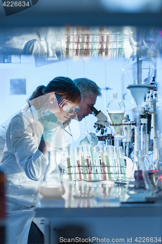 Image of Health care researchers working in scientific laboratory.