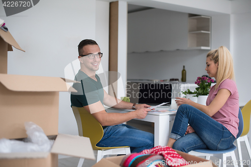 Image of Young couple moving in a new home