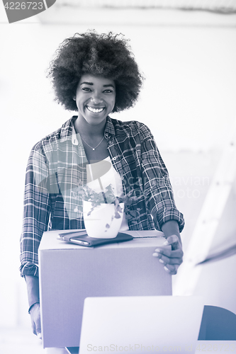 Image of Black girl moving in the new apartment