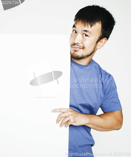 Image of pretty cool asian man holding empty white plate smiling