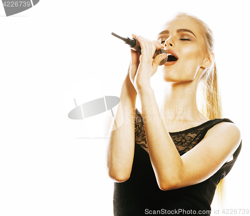 Image of young pretty blond woman singing in microphone isolated close up