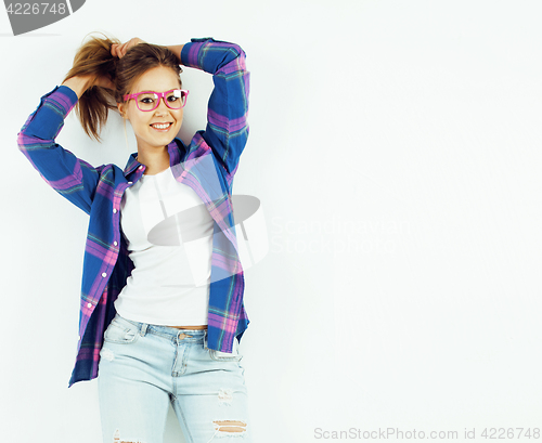 Image of young pretty teenage hipster girl posing emotional happy smiling on white background, lifestyle people concept 