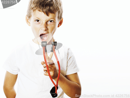 Image of little cute angry real boy with slingshot isolated