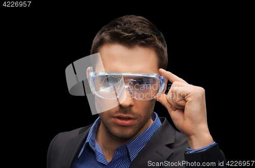 Image of businessman in virtual reality or 3d glasses