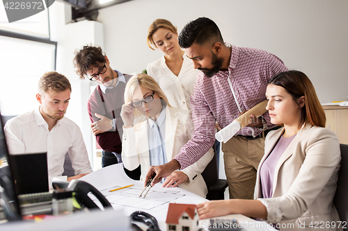 Image of business team discussing house project at office