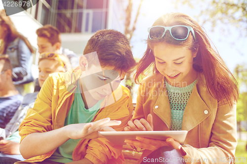 Image of group of students with tablet pc at school yard