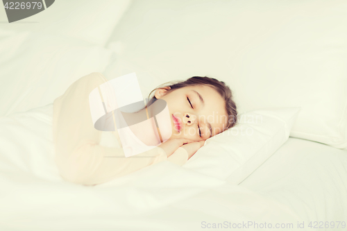 Image of girl sleeping in bed at home