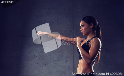 Image of woman boxing in gym