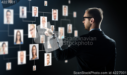 Image of businessman pointing finger to