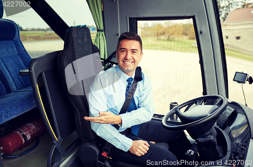 Image of happy driver inviting on board of intercity bus