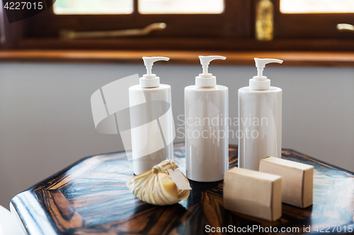 Image of bottles with liquid soap or lotion at spa