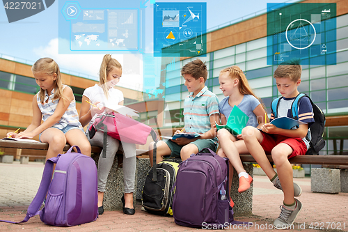 Image of group of happy elementary school students outdoors