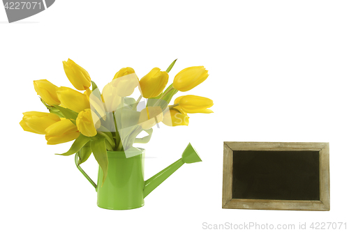 Image of Beautiful tulips and blank blackboard