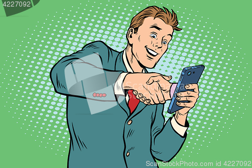 Image of business handshake via smartphone