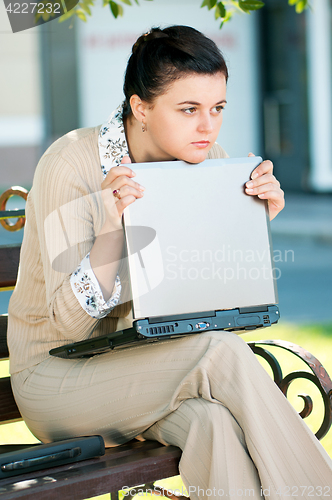 Image of Business woman in summer park