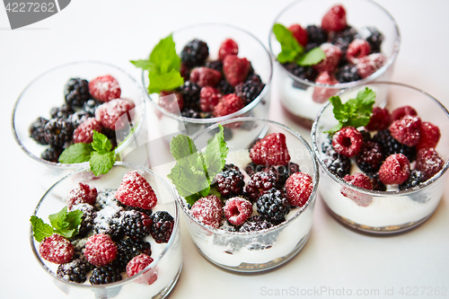 Image of Blackberry and raspberry in the white yogurt.