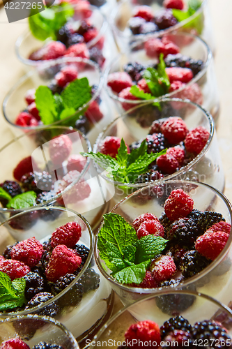 Image of Blackberry and raspberry in the white yogurt.